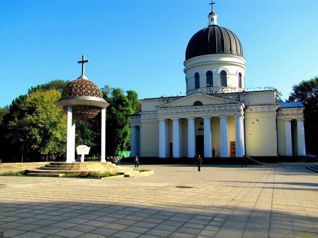 Nativity Cathedral in Chisinau Moldova with black dome white columns and spherical bell tower Wallpaper