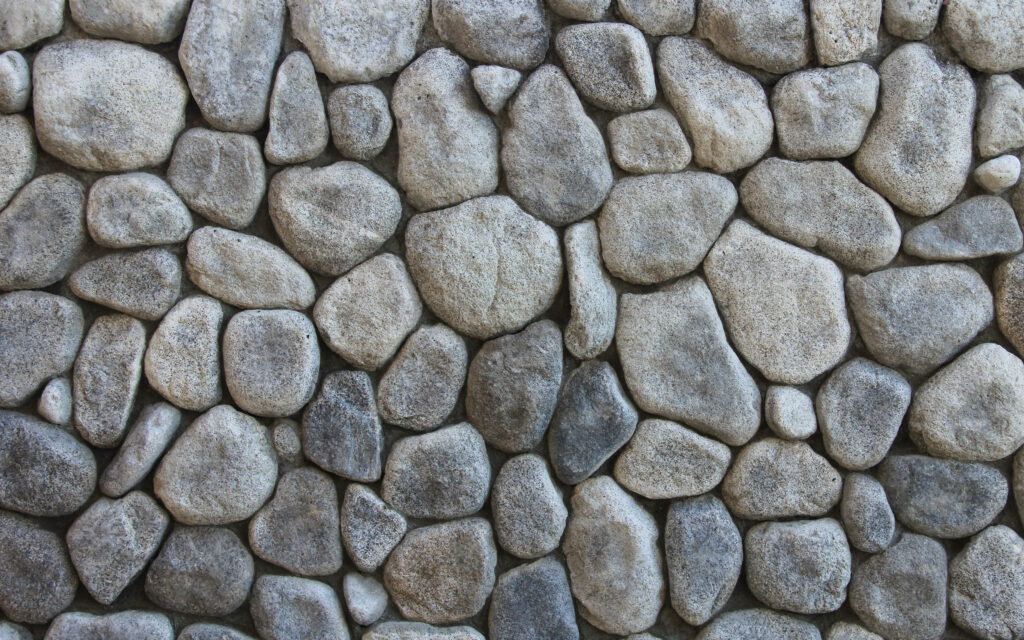 Rustic Charm: Simple Stone Wall Mosaic Desktop Wallpaper