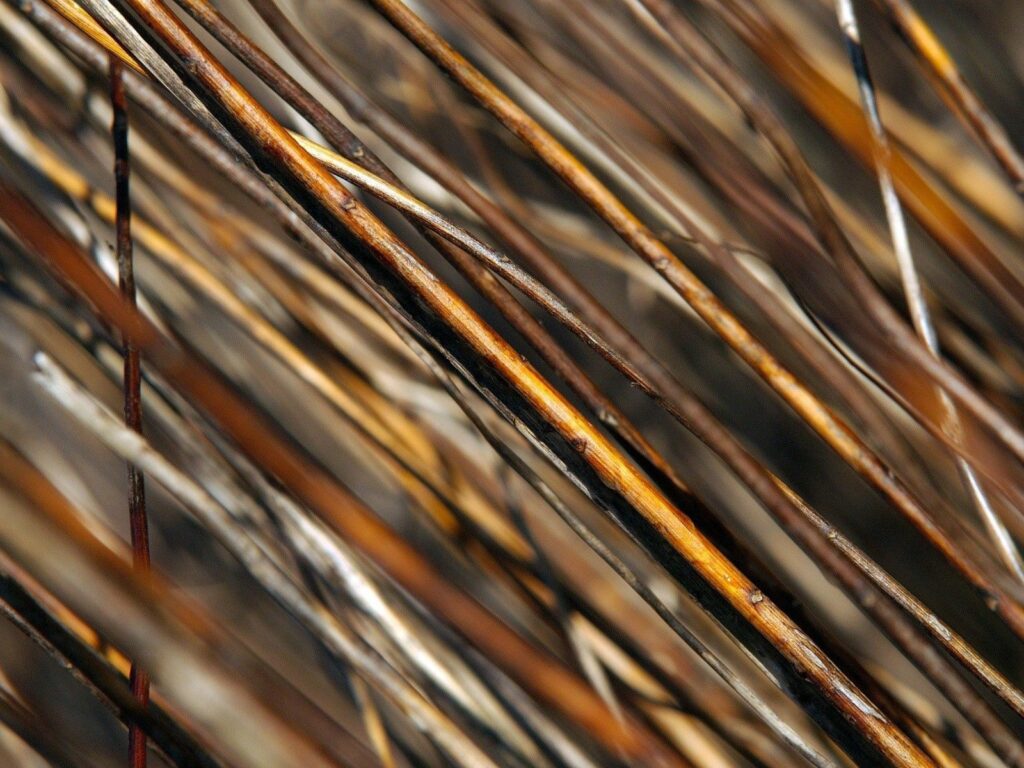 Earthy Texture Wallpaper: Close-Up of Brown & Gray Wooden Rods