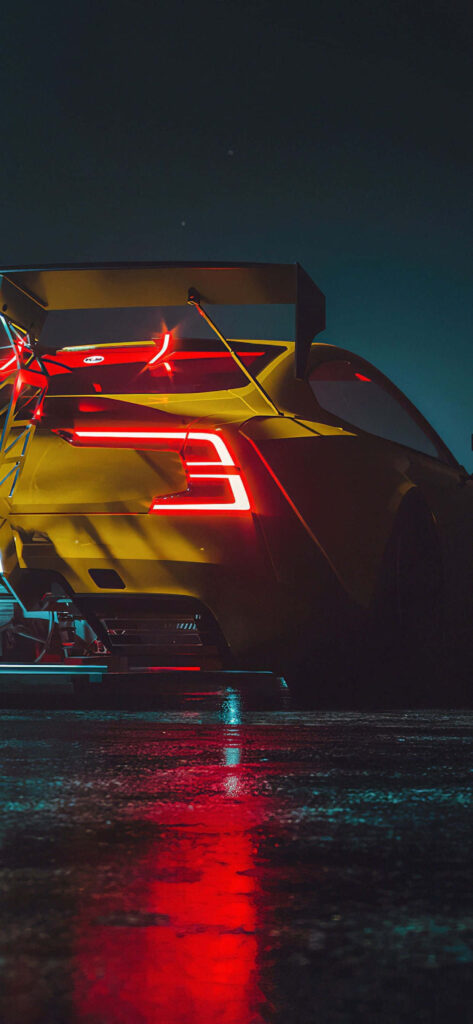 Yellow Need For Speed Heat car with glowing rear lights on wet pavement at night wallpaper