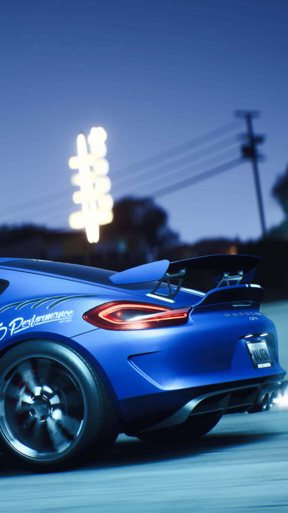 Dark blue Porsche Cayman speeding through neon-lit night scene Need For Speed Payback wallpaper