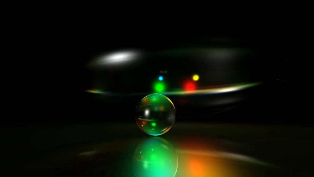 Futuristic Neon Ball Wallpaper: Glowing Lights on Dark Background