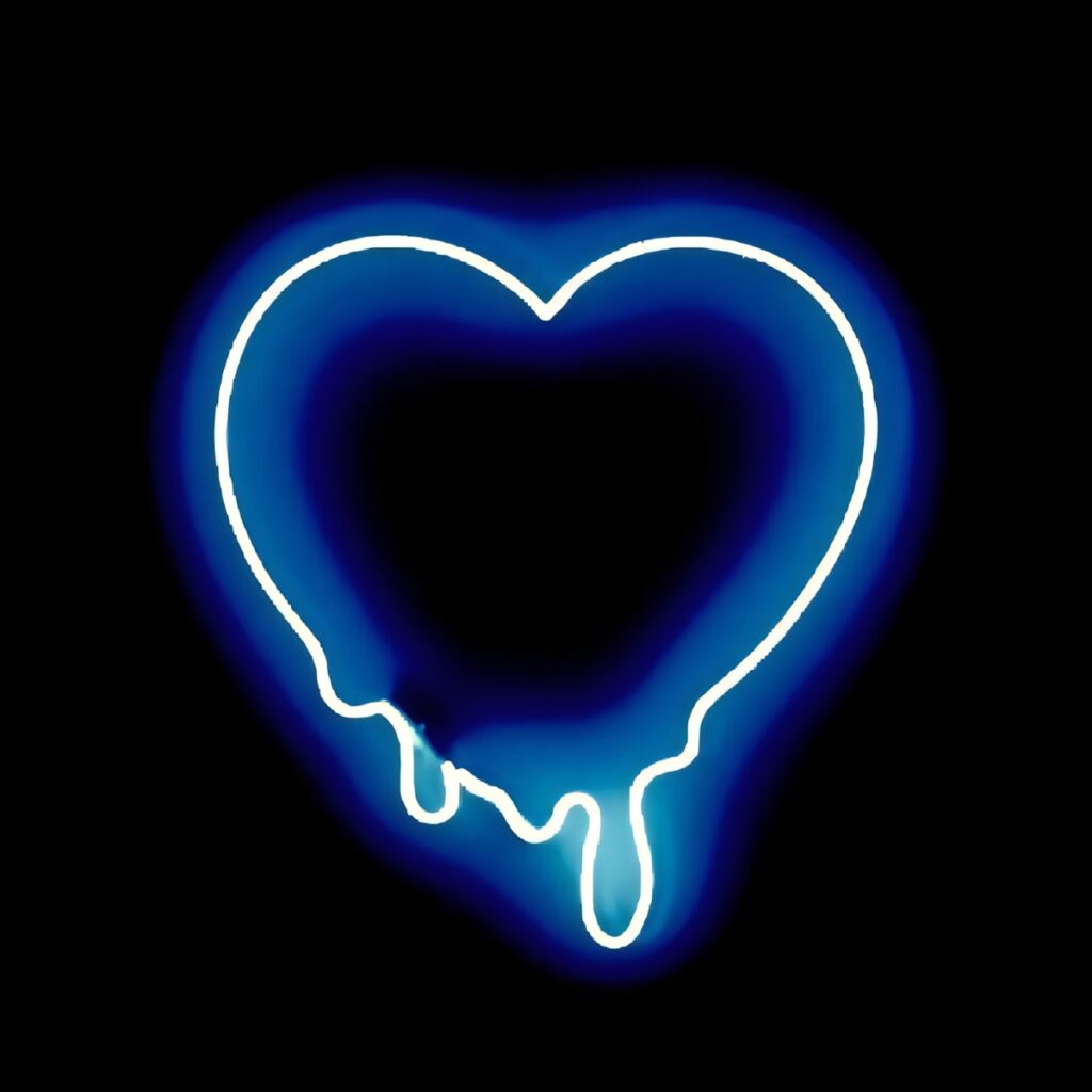 Vibrant Neon Blue Heart Wallpaper with Melting Effect on Dark Background