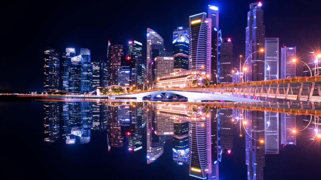Vibrant Neon Cityscape Reflection at Night - Stunning Wallpaper