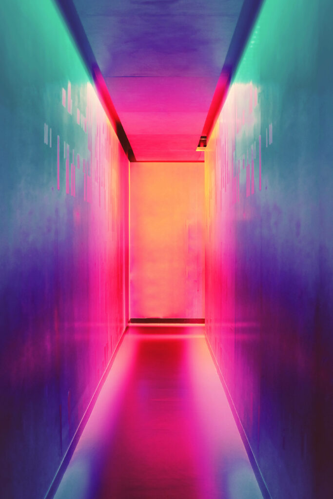Futuristic neon hallway wallpaper with glowing pink magenta orange gradients and minimalist design