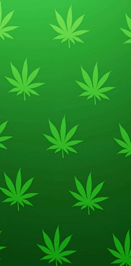 Seamless neon green cannabis leaf pattern on gradient green background digital wallpaper