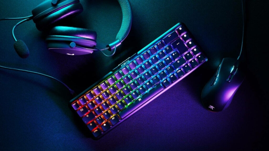 Glowing Keys: An Electrifying Computer Keyboard Illuminates a Stylish Desk Setup Wallpaper