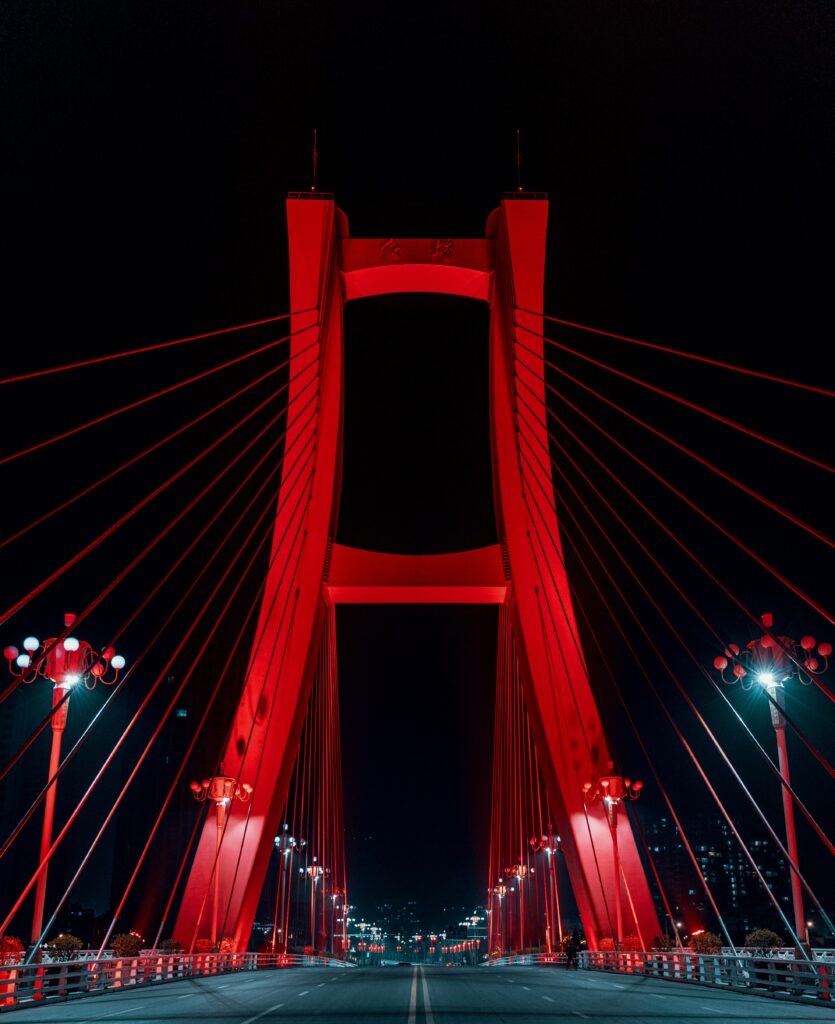 Neon-Lit Red Bridge Wallpaper: Captivating Urban Night Sky Design