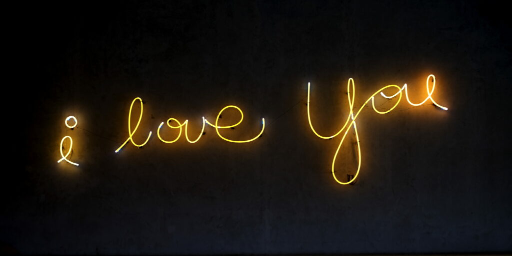 Neon Love: A Radiant Illustration of an 'I Love You' LED Light Sign as a Wallpaper