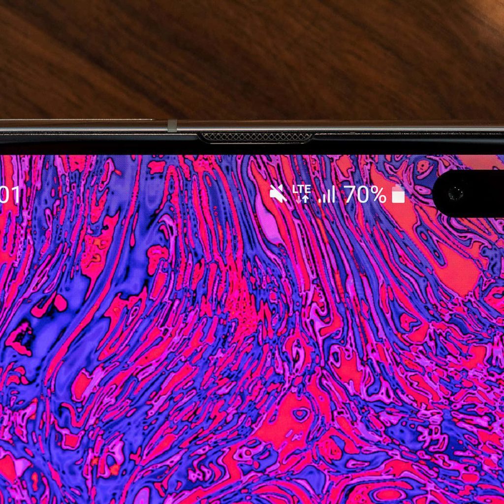 Abstract liquid swirl wallpaper in neon magenta and indigo vibrant high contrast for Samsung Galaxy