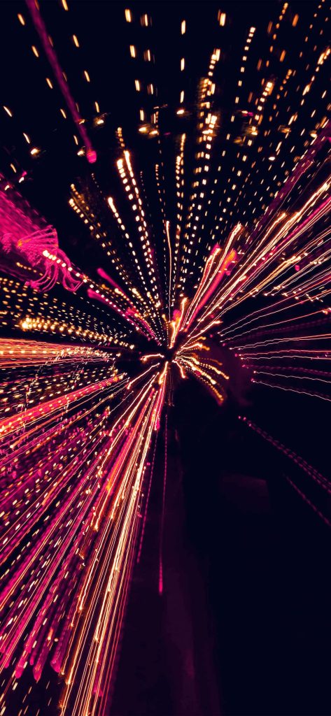 Black and pink fireworks wallpaper with vibrant neon light trails on deep black background for iPhone