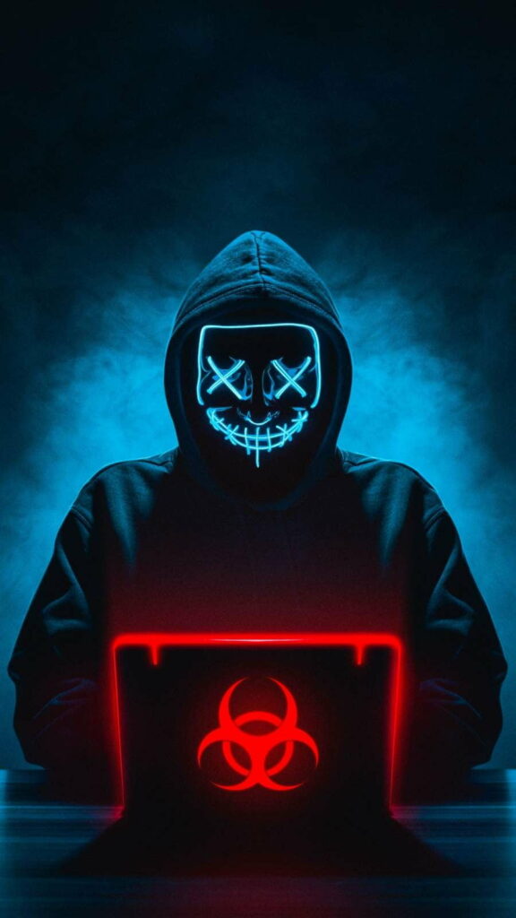 Mysterious figure in glowing Purge mask, working on laptop, biohazard symbol - dramatic HD wallpaper