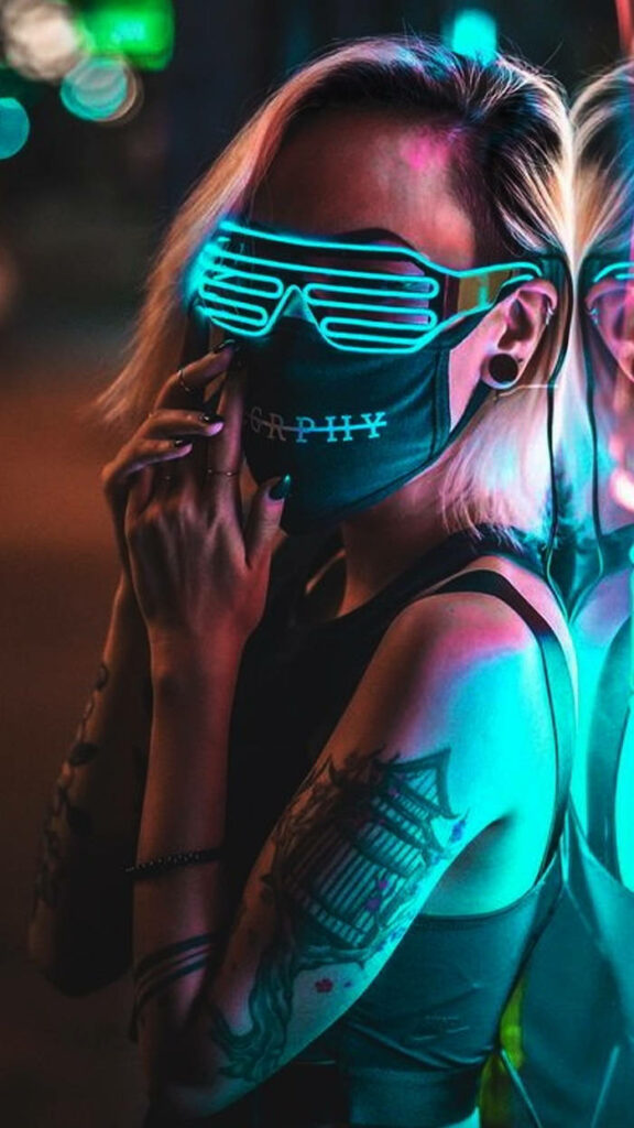 Electric Elegance: Immersed in Cyberpunk Couture against a Futuristic Backdrop Wallpaper