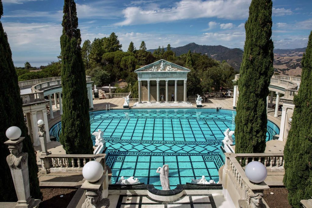 Neptune Pool at Hearst Castle with turquoise water Greek key tiles Roman colonnades and cypress trees Wallpaper