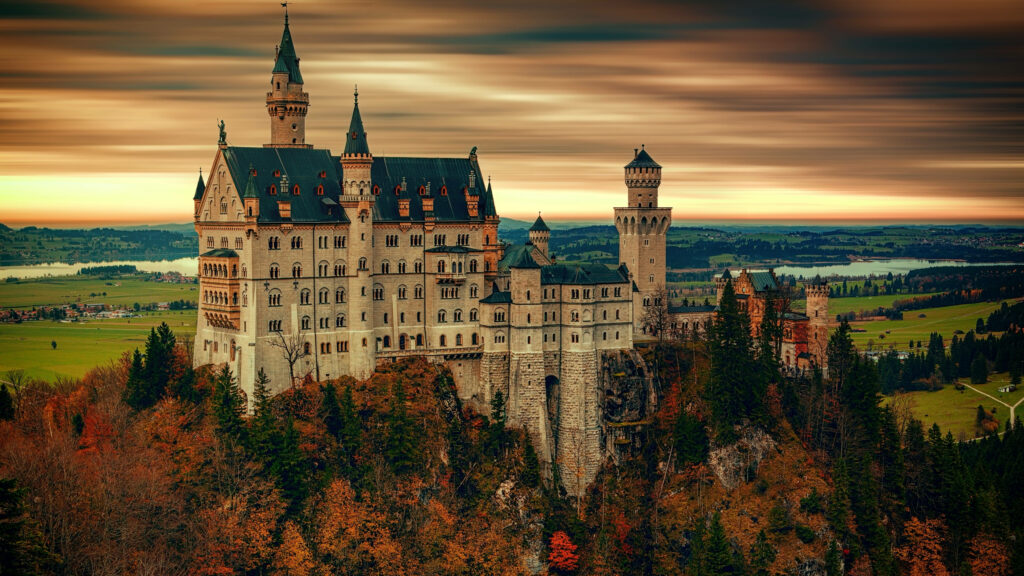 Neuschwanstein Castle Wallpaper: Autumn Foliage & Sunset Beauty