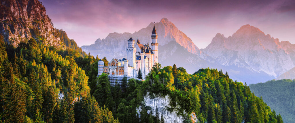 Neuschwanstein Castle: Fairytale Wallpaper with Pink Sky & Green Forests