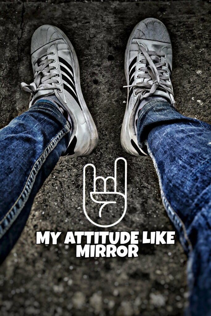 White sneakers blue jeans on pavement with rock on hand and bold attitude street style text wallpaper
