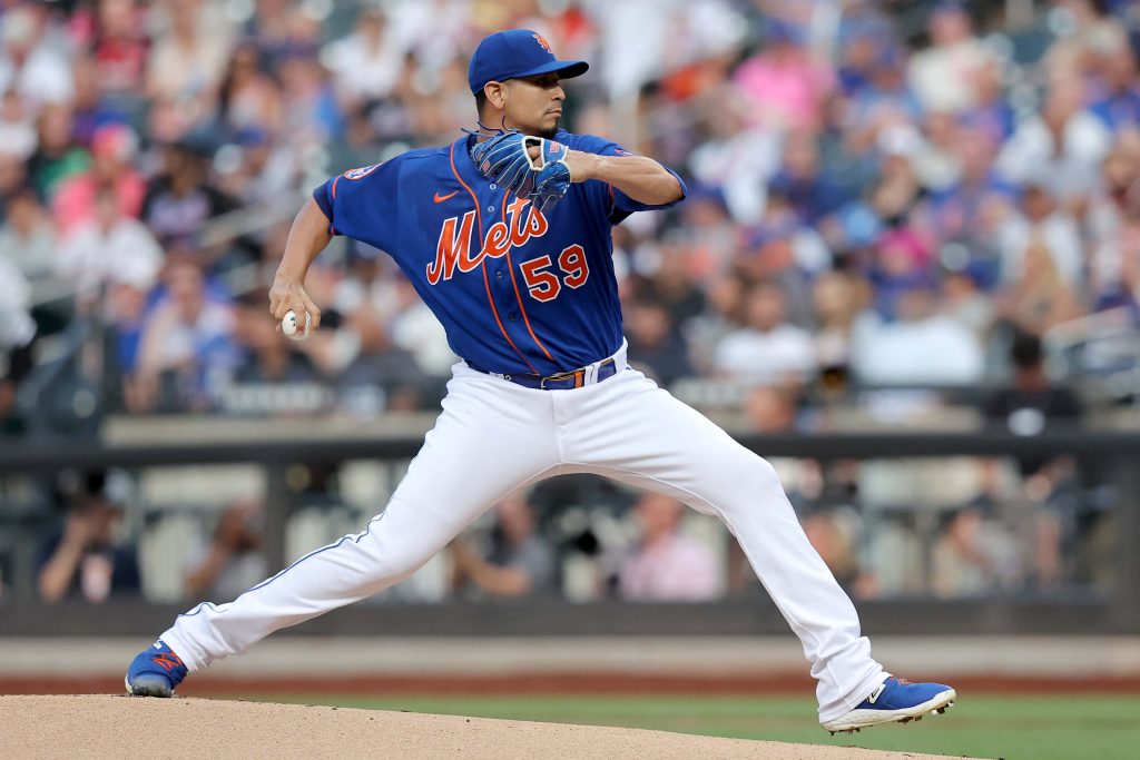 New York Mets pitcher mid-throw in blue jersey white pants vibrant MLB game action wallpaper