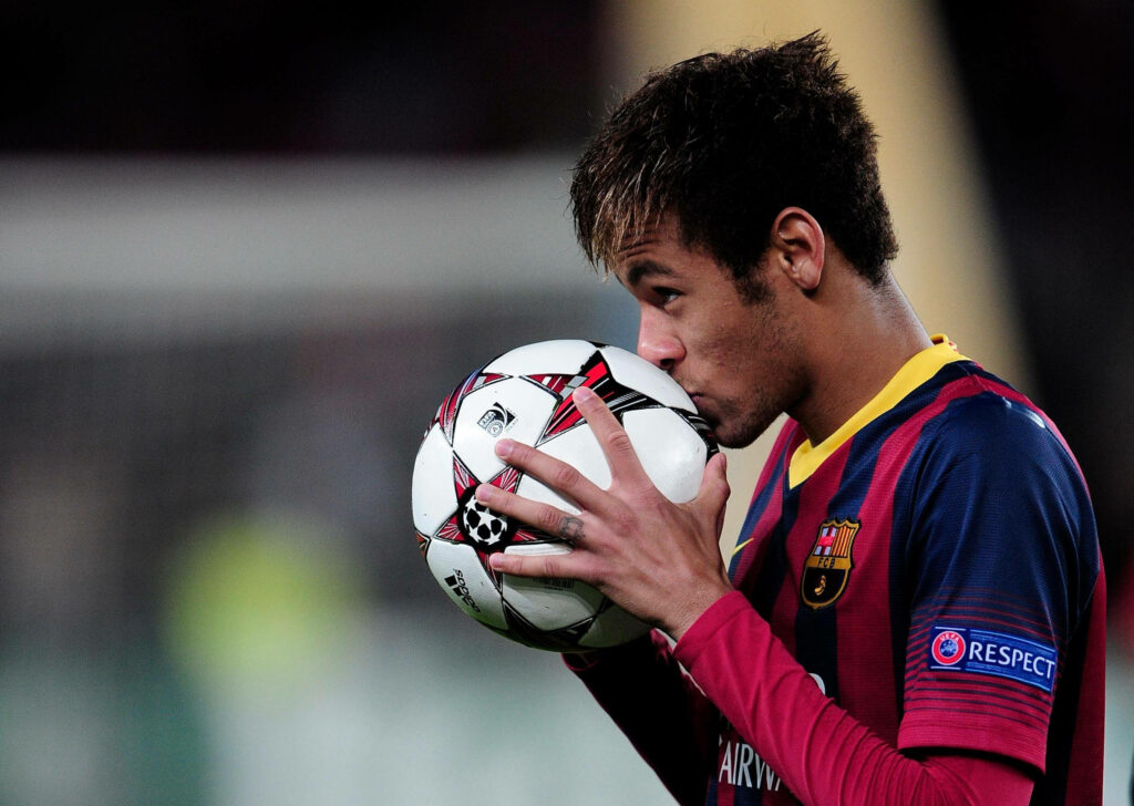 Neymar Jr: Reverently Embracing the Football in a Game Wallpaper