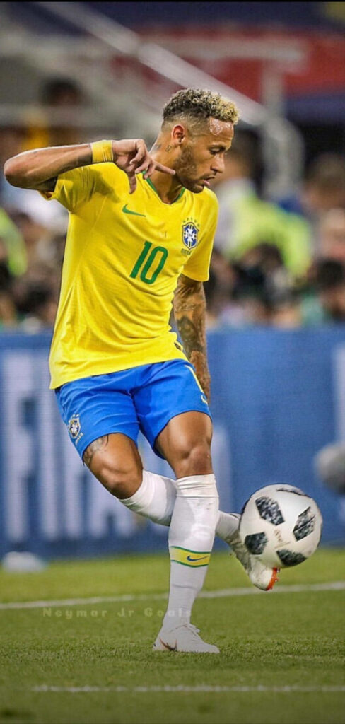 Dazzling Display: Neymar's Mesmerizing Dribbles Illuminate the Football Field Wallpaper