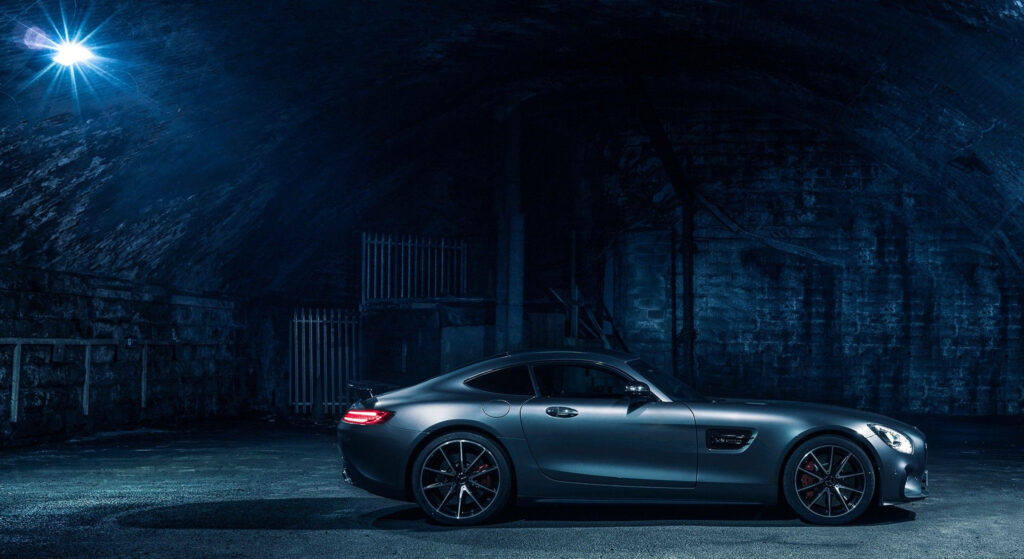 Night Drive Through the Forgotten Cityscape: 4k Background Photo of a Mercedes-AMG Luxury Car Wallpaper