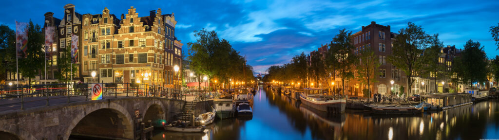 Enchanting Amsterdam Nights: Captivating 4k Ultra Widescreen Canalscape Wallpaper