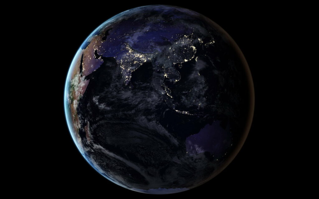 Glowing Planet: Captivating HD Wallpaper of Earth Illuminated at Night
