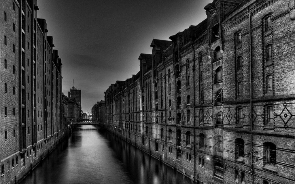Historic Black-and-White Wallpaper: Nighttime River Scene with Bridge
