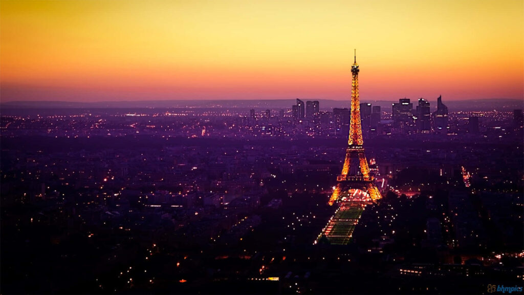Enchanting Nighttime Spectacle: Eiffel Tower Embraced by a Stunning Sky Wallpaper