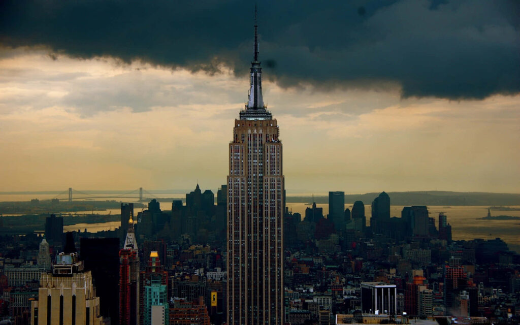 Radiant Nighttime Glow: Captivating Snapshot of the Iconic Empire State Building Wallpaper