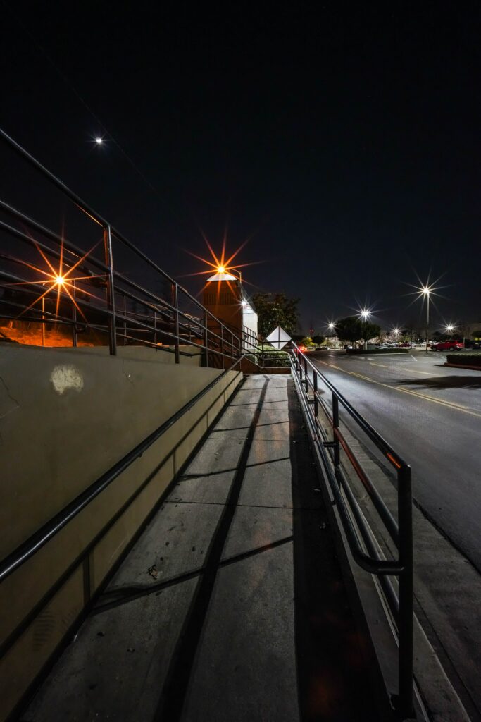 Nighttime Street View Wallpaper: Illuminated Passage with Handrails