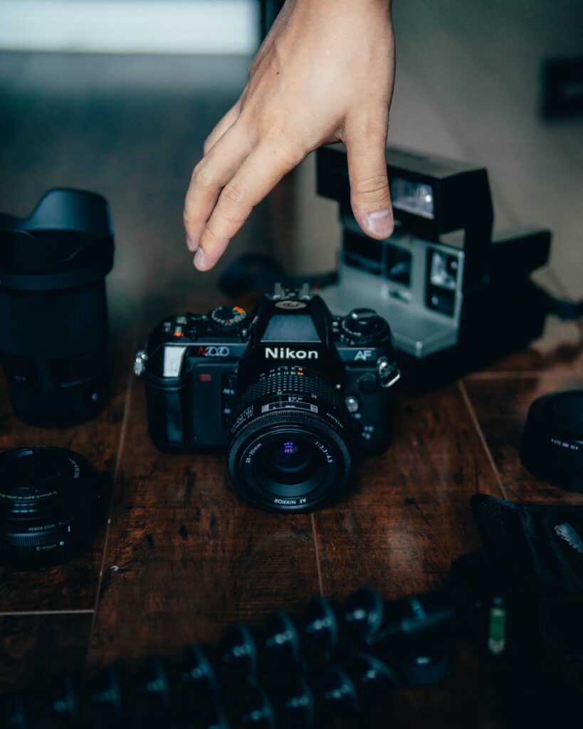 Nikon Camera Wallpaper with Photography Gear & Artistic Touch
