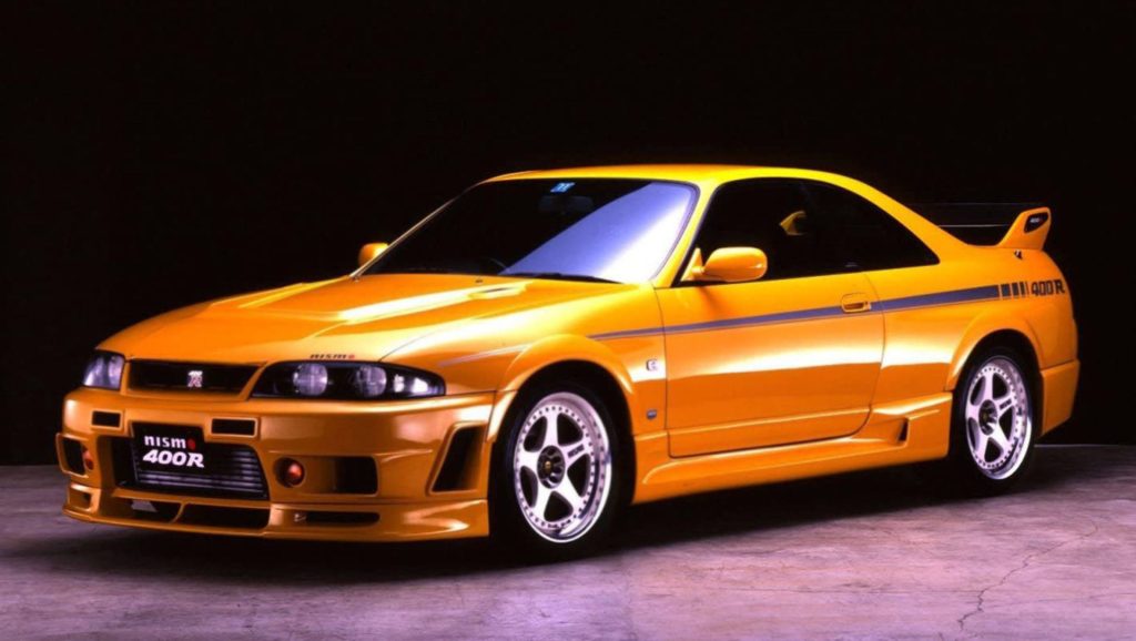 Nismo 400R Lightning Yellow Nissan Skyline GT-R R33 studio wallpaper JDM performance car