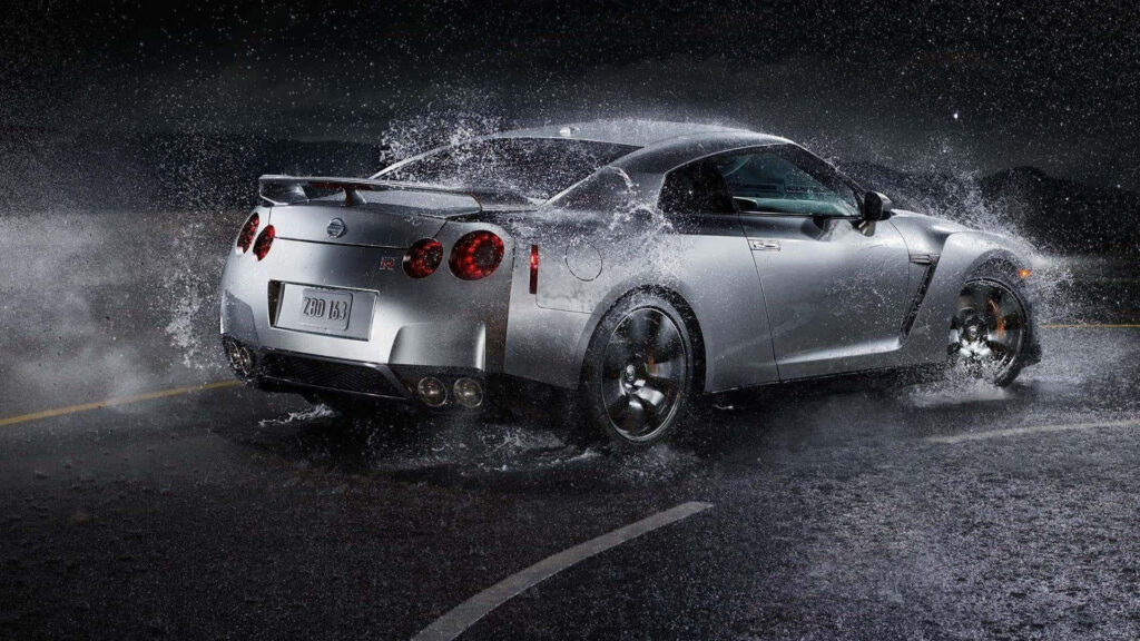 Sleek Nissan GT-R Rain Wallpaper: Power & Speed at Night
