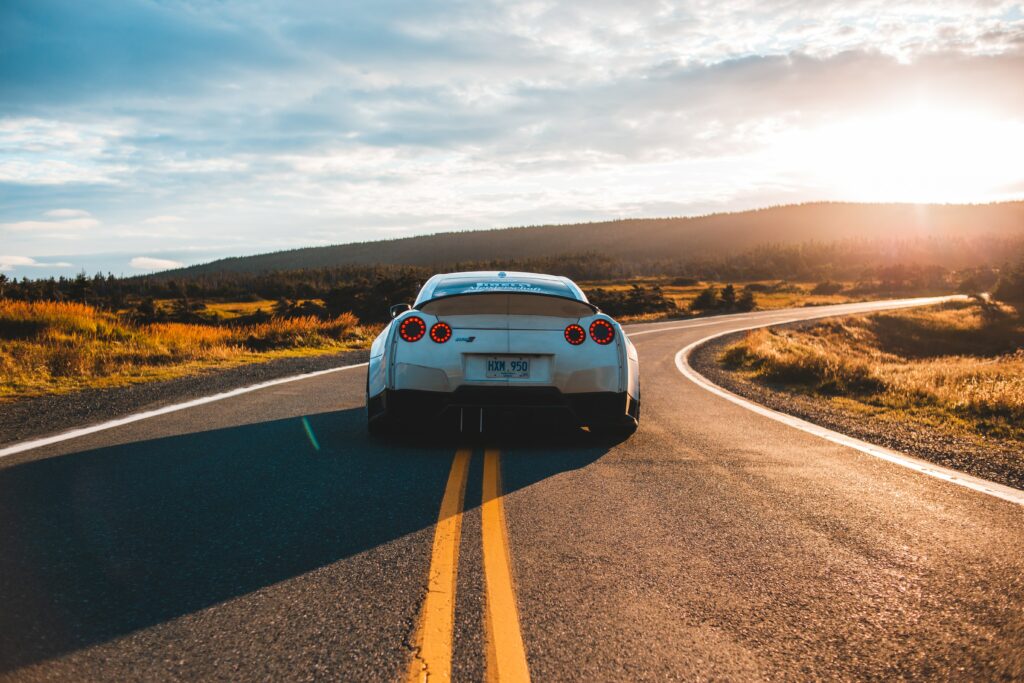 Nissan GT-R Rear View Wallpaper: Sportscar on Scenic Winding Road