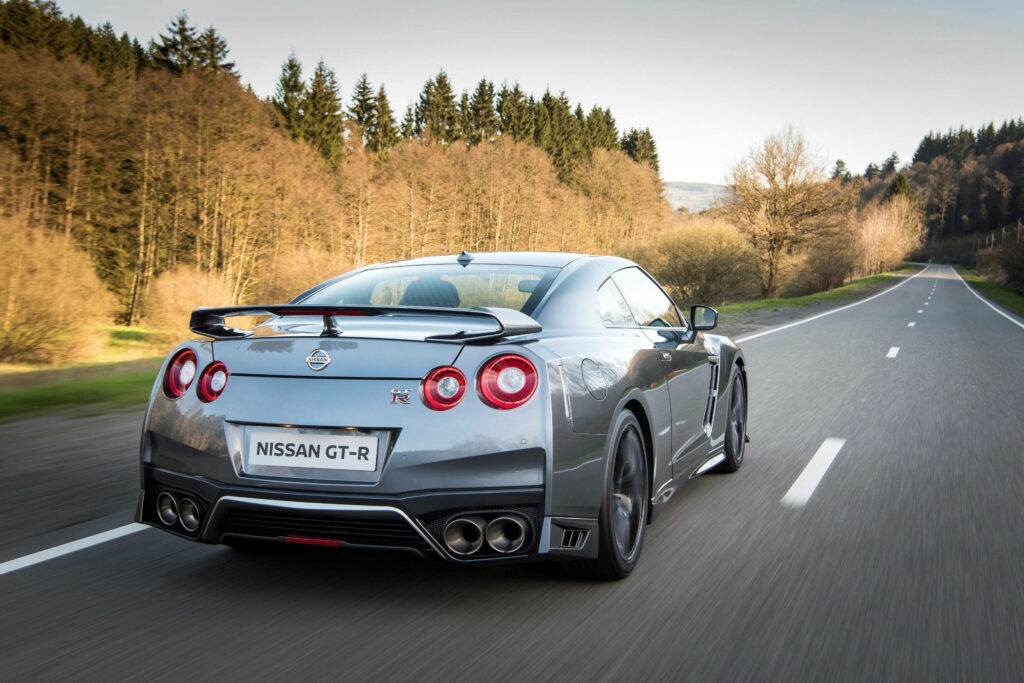 Sleek Nissan GT-R Wallpaper: Speeding Through Scenic Hills