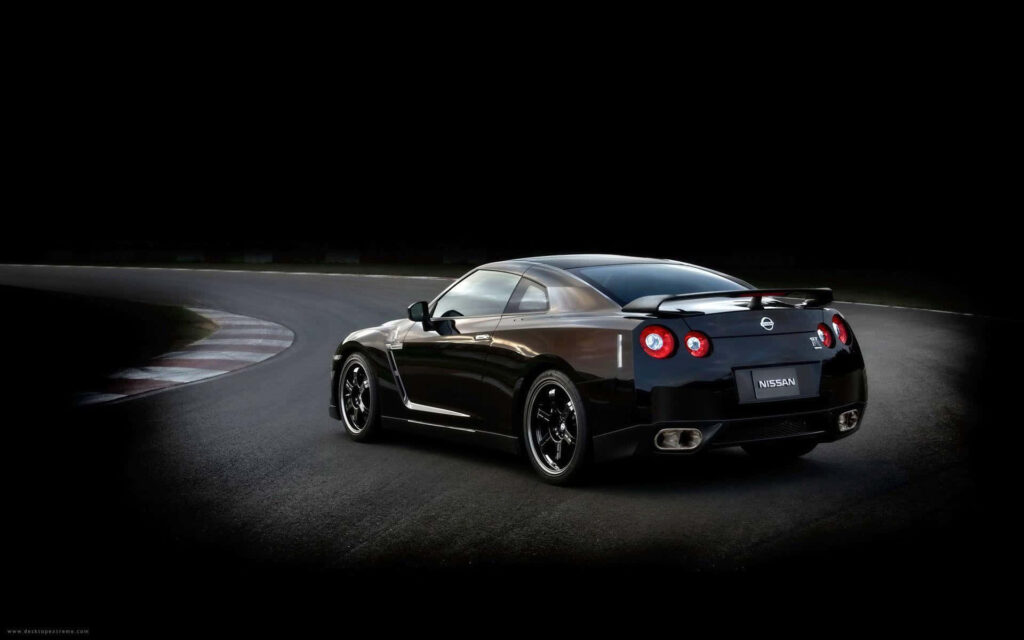Revving Up the Color: Nissan GTR Desktop Wallpaper with Vibrant Car and Colorful Background Photo