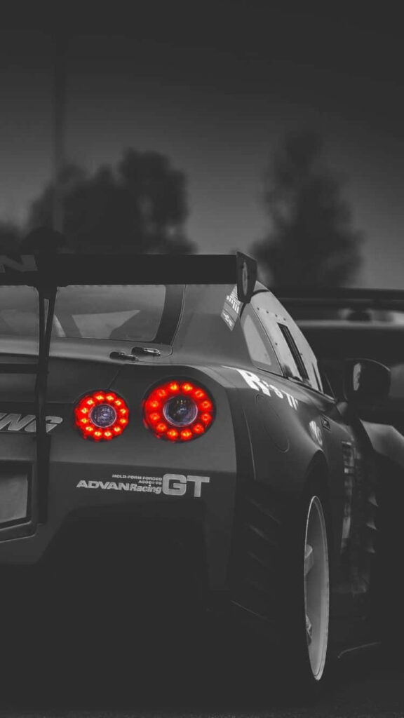 Black and white Nissan GTR R35 rear view with glowing taillights and racing details wallpaper