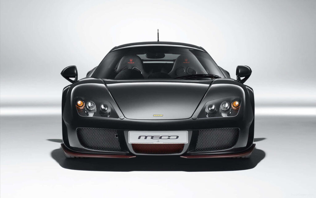 Black Noble M600 sports car front view in studio highlighting aggressive design and luxury Wallpaper