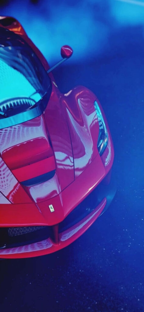 Vibrant Eruption: Mesmerizing Max Ferrari Enveloped in Mystical Blue Haze Wallpaper
