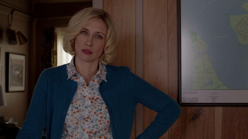 Norma Bates tense moment inside dark Bates Motel suspenseful wallpaper background scene