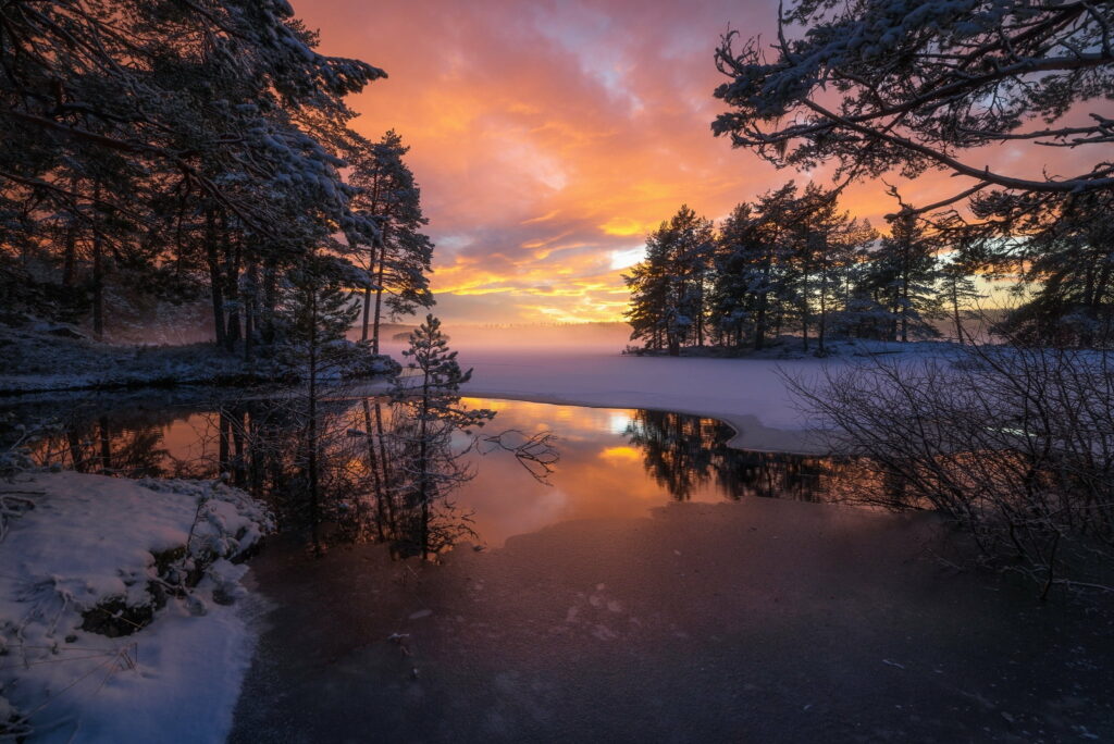 Ringerike Serenity: Majestic Sunset Over Snowy Norwegian Fields and Scenic Lake Wallpaper