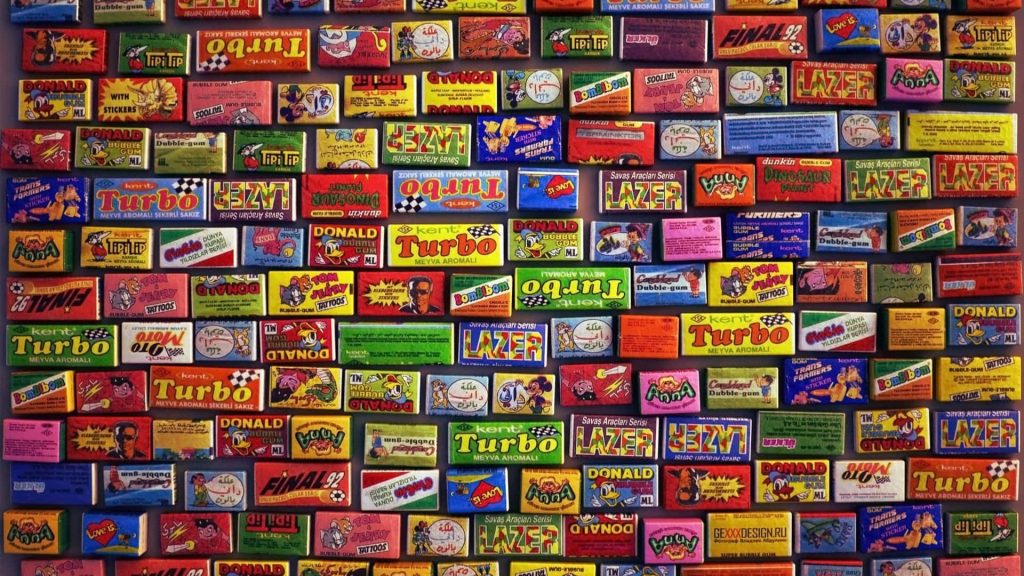 90s nostalgic wallpaper with vibrant retro bubble gum wrappers grid featuring iconic brands