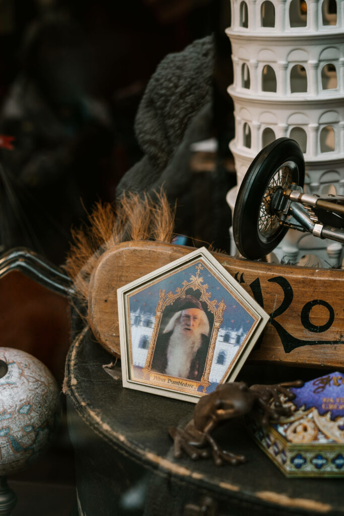 Nostalgic magical memorabilia collection with Albus Dumbledore portrait wizarding world wallpaper
