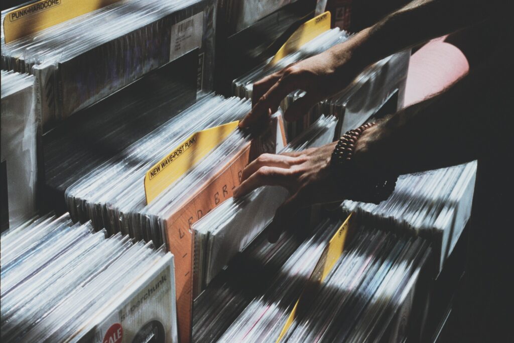 Nostalgic Vinyl Record Browsing Wallpaper - Love for Analog Music