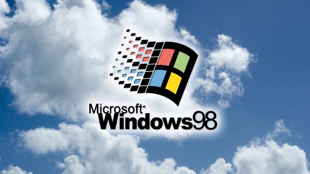 Windows 98 wallpaper with classic colorful logo on bright blue sky clouds retro computing background