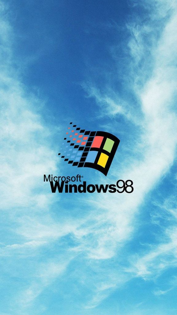 Windows 98 wallpaper with iconic Microsoft logo and vibrant blue sky with soft clouds background