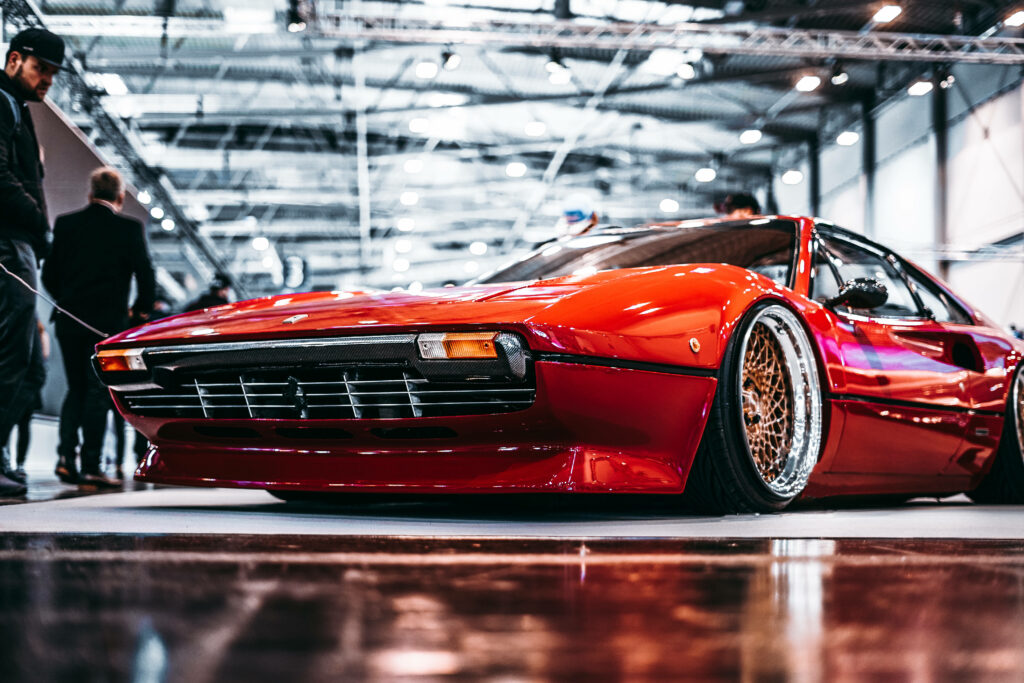 Exquisite Captured Snapshot: Sleek Red 4k Modified Ferrari 308 Model at Low-Angle Shot Wallpaper