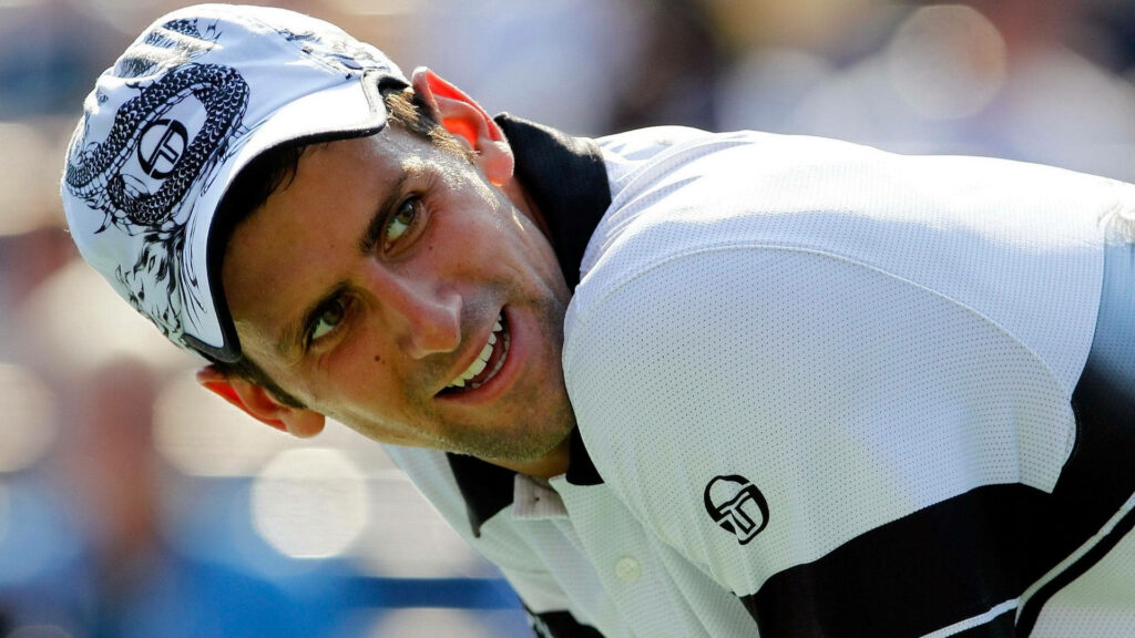 Focused Novak Djokovic Wallpaper: Iconic Style & Match Intensity