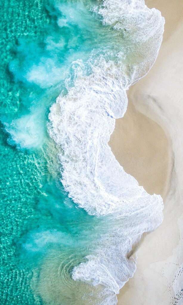 Serene Seascapes: High-Definition iPhone Lock Screen Wallpaper with a Cool Ocean Background